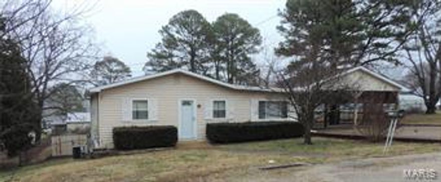 Cozy 2 bedroom home in a private lake development! This home has lots to offer such as a large fenced in yard, double carport, large living room, and a separate dinning room! The lake development has a small beach and boat ramp access close to the home.