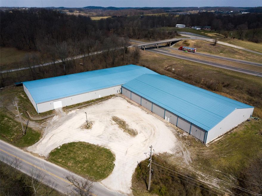 Located .25 mile from I/55 and US Hwy 61, this property has great visibility from Interstate 55.  2 heavy metal frame buildings on concrete slabs.  Building 1 is 275'x120', building 2 is 200'x120'.  Gravel parking lot.  Lots of options here. SpecialListingConditions: Foreclosure Location: Hwy/Interstate Frntg