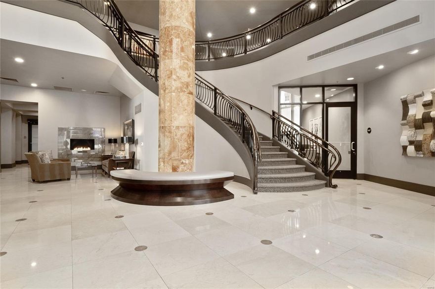 Located in the heart of Clayton on premiere Carondelet Plaza, this gorgeous font facing 2 bed, 2.5 bath unit with office offers carefree living without the need for updates.  From the rich wood floors to the paneled built ins, you will find a place for everything including your treasures and artwork.  The open kitchen with center island, seating and custom cabinetry comes complete with walk in pantry, all located steps from the bar area. The centerpiece of the unit is the open great rm with easy access to the front facing large balcony with gas hookup.  The spacious master suite offers updated marble bath with walk in shower, his/her vanities and gorgeous soaking tub.  2 large walk-in closets have been professionally customized.  An office with a builtin task area is also included in the Master Hall.  With privacy in mind, another large bedrm suite with spa bath and huge closet can be found next to the unit's separate entrance.  Find a laundry/utility room with cabinetry also in unit. Location: Upper Level