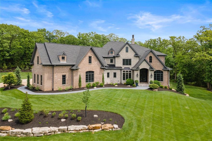 A truly special home perched atop 3 rolling acres with view of lake.One of the only long standing private roads still rich with the country character from days long before Town & Country was transformed into predominantly 1 acre lots.Built in 2015, this custom home is fully loaded with high-end finishes/amenities. Kitchen open to dining area, great room, pool and veranda. DR & LR with bar complete the main entertaining areas. Lovely master suite with steam shower/heated floors, office, laundry, mudroom & 1/2 bath complete the main. 4 additional bdrm suites on 2nd floor. Partially finished lower level with exposed ceiling currently used as fitness space, wine room, sauna & golf simulator, roughed in fireplace and bath. Saltwater pool/spa, extraordinary newer 700 sqft pool house & outdoor kitchen, putting green, covered outdoor veranda w/ fireplace, oversized & heated 4 car garage, whole-house generator and more. A slice of "Country" located minutes from all the city has to offer!