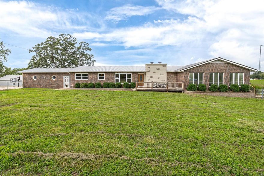 This house has it all, & sits on OVER 5.5 acres! 6 bedroom, 3.5 bath, inground pool, detached shop, basketball court, & pond! Walk in & notice the stone fireplace with hardwood flooring, & oversized rooms. Main floor features HUGE living room, tons of natural lighting. Kitchen has solid surface counter tops, modern color schemes & stainless steel appliances. Divided bedroom floor plan leaves 3 bedrooms w/ hardwood flooring, separate from the grand master suite. Master suite features laminate flooring,large windows,coffered ceiling, & walks out to the newly installed partial wrap around deck. Suite also features a huge bathroom with a  fireplace & soaker tub, built in cabinetry, & tons of closet space. Basement has living room, newly remodeled bath, 2 bed & bonus room that could be 7th bedroom (no window).Basement has a large work space for extra storage. Exterior has new metal roof (Aug 2023) So many great features to talk about with this home, but instead take a look for yourself!