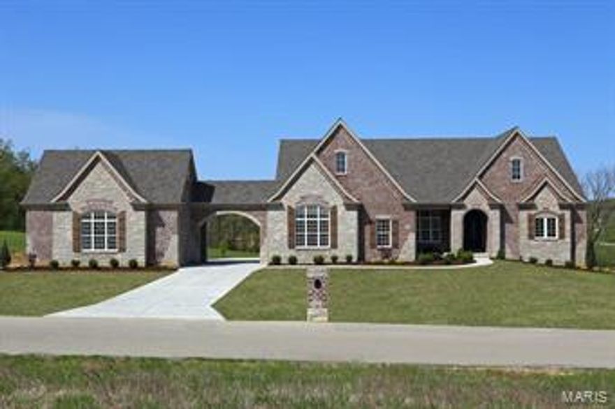 Stunning Ranch Inventory Home by Clement Construction Co. now completed at
Avondale Meadows! Picturesque 3 acre home site just 5 minutes from Hwy 40 at
Winghaven. Stately brick & stone front elevation. Porte-cochere, 5 plus car garage
parking. Exceptional quality & craftsmanship thruout. Custom 10' iron entry doors. 11'
ceilings & transom topped windows w/Low-e glass. Hardwood flooring and a custom wood
staircase. Chef's kitchen features high-end Thermador appls including Prof. 48" 6 burner gas
range w/double ovens. 48" built-in fridge. Huge island w/chimney hood vent. Quality
cabinetry w/soft close drawers, under cab lights & granite tops. Hearth rm w/stone frplc.
Luxury mstr bath w/travertine & granite finishes. Custom shower with 3 heads. Large
secondary bdrms each have private baths. Deep pour walkout LL w/rough-in for bath &
bar. Dual zoned HVAC. Large patio & composite deck. Great location just minutes from
parks, shopping & Wine Country. Don't settle for ordinary! Additional Rooms: Mud Room