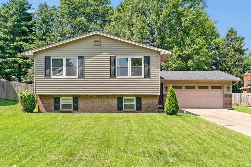 Updated kitchen with 42” cabinets, granite counters, pantry & center island.  Wood laminate floors in living room & ceramic tile in kitchen & dining area.  Guest bath has updated comfort height vanity & toilet as well as tile tub/shower.  Private master bath also has comfort height vanity & toilet and tiled shower.  Master bedroom with walk in closet.  Updated shaker style interior doors.  Wainscoting in dining area.  Tilt in windows, fenced yard, oversized patio (10x20) & EXTRA BIG GARAGE with work/hobby area.  Finished lower level with extra living space: family room with fireplace, exercise room & sleeping area.  Low maintenance vinyl exterior on cul de sac lot – walk to city park.  Convenient to library, schools, shopping, Starbucks & more!!  Seller leaving refrigerator, washer & dryer so please include in offer.