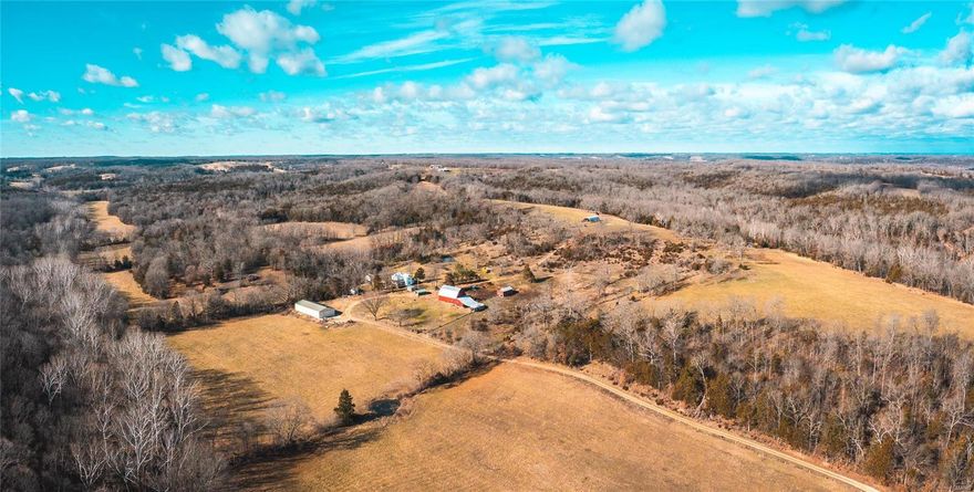 Extremely rare opportunity on this 416 +/- acre farm bordering the Maries River in Osage County, MO. The Maries is well known for smallmouth bass and floating. The 1920s farm house overlooks part of the 26.5 Acres of tillable ground currently in pasture/hay production. An additional 70 acres of creek bottom and ridge field provide some excellent soil as well and bring the total open acreage to roughly 100 acres. The farm setting consists of a large 40x90 shop with concrete floors, large sliding doors, walk-in cooler, and electricity as well as a beautiful old red sided, tradition barn. A hoop building is located on the ridge field. The farm has produced some impressive deer over the years primarily due to the proximity to the river and the thick timber that mature bucks prefer for bedding. There is no shortage of turkeys in the area as the farm has some great turkey habitat as well. Additional items include over a dozen ponds and one field offering target shooting out to 700 yards.