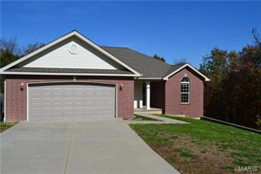 This home is BEAUTIFUL!!! The living room room features a decorative ceiling, large windows to let plenty of sunshine in and a stone covered fireplace and canned lighting. The kitchen has all black appliances with a breakfast bar, beautiful cabinetry and plenty of canned lighting and a dining area. This divided floorplan has the master bedroom one one side with a decorative ceiling and the master bathroom features a double vanity, separate shower and jetted tub. The spare bedrooms on the other side of the home features large beautiful windows, one has cathedral like ceilings. A full bathroom separates the two bedrooms. The laundry room is on the main level off the kitchen. The huge almost fully finished walk out basement offers plenty of space that could be used as a bedroom, office, workout room, den or whatever your mind can conceive,big unfinished room for storage.A deck off the basement, fully fenced in back yard with a large deck on the rear of home. Don't miss out on this beauty.