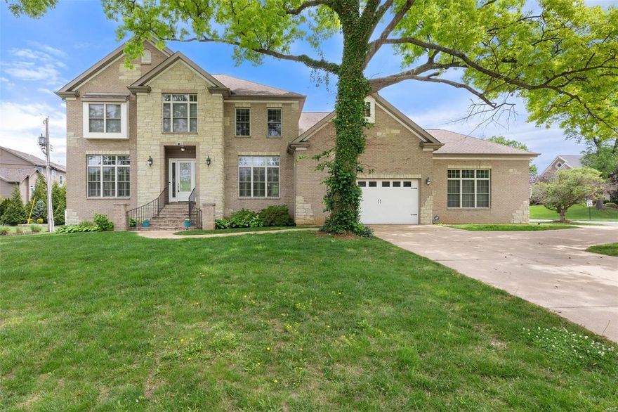 Nestled in Harwood Hills, this stunning 2-story boasts a commanding presence w/brick & stone exterior, nearly ½ acre corner lot, 4 car garage & 5700 sq ft of luxurious living space. Gorgeous hardwoods, arched doorways, tray ceilings, bay windows & a spectacular wood burning fireplace grab your attention. A thoughtful floorplan w/front & rear staircases, dining rm, office/playroom, great rm, gourmet kitchen, b’fast rm w/walk-out to composite deck, laundry & ½ bath on main. Upstairs 5 beds/3 baths include a jaw dropping primary suite w/sitting room, walk-in closet & spa-like bath; a massive BR converted from an open loft space; 2 spacious BR’s w/Jack & Jill bath; & a large BR suite. Incredible 9’ pour LL includes a BR, full bath, rec room & bonus room w/kitchenette providing the ultimate entertainment space or perfect for multi-generational families.This property presents an unparallel opportunity for discerning buyers seeking an extraordinary home near everything Des Peres has to offer!