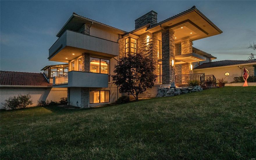 PRICED TO SELL! One of the most substantial homes you can buy under $2,000,000!  This legendary significant landmark provides an opportunity to acquire one of Creve Coeur’s largest & most exclusive properties. Stunning breathtaking views of the ~26 acre lake from all 3 levels of the home ~6.9 acres of adjoining common ground/tennis court. 6 total bedrooms, total 6 full& two 1/2 baths, ~8496 sq ft. Sumptuous appointments: expansive walls of glass flood nearly every room with natural light, 2 story great room, marvelous bedrooms-retreat-like master suite with stone fireplace/office-study & balcony, downstairs recreation room/fitness center & ~1800 bottle wine cellar/bank vault. The centerpiece is a~1728 sq ft-indoor resort style pool, waterfall, fountains & spa. 5 car heated garage. 1 acre lot, stone interior walls & fireplaces-2 stone+1 marble, marble floors, elevator, terraces/balconies, au pair suite/ kitchen, enclosed porch, huge paver driveway, fish pond, magnificent clay tile roof. Additional Rooms: Wine Cellar