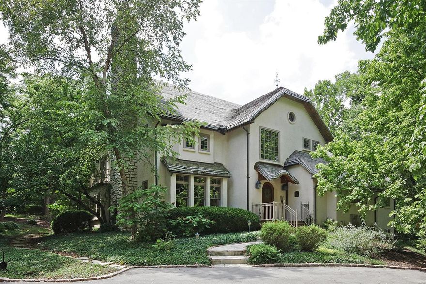 With a most exclusive address & location, this architect designed home built in the late 20th century blends old world sensibility w both modern & repurposed materials. Think, updated cotswold cottage, while reflecting elements of the iconic mission style. Sensible & dramatic details include custom hewned & paneled drs, special artistic windows, wood flrs, craftsman staircase & millwork, & 1 of a kind charm. The simple lines welcome any type of furnishing or décor. Stepdown living rm w stone firplace, large dining rm w box bay & spacious custom equipped gourmet kitchen w huge breakfast rm. Dramatic yet comfortable family rm serves as a vaulted retreat, complete w a 2nd frplce & restful view of the spectacular lot. Main flr master suite w lrge luxurious bath, private library, terrace & his/hers closets. Delightful 2nd flr w 4 additional bdrms offering dormered ceilings. Simply so many details, you just have to wander inside & take it in! This one owner home is truly a hidden treasure!