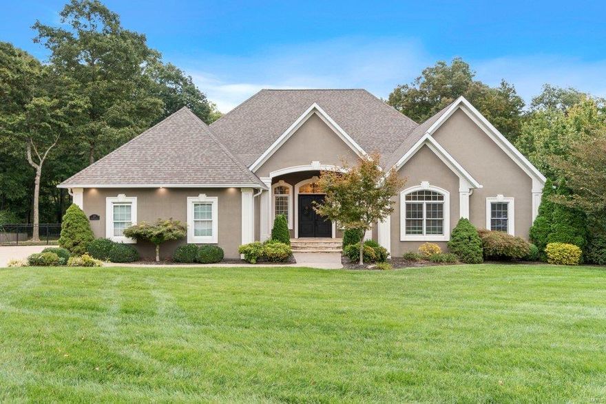 Space abounds in this Executive home, & there is something for everyone! Boasting over 8300 Sq Ft of living space, this home offers an exquisite master suite with its own foyer area, a fireplace with built ins, & a “to die for” master closet, with a closet laundry. The great room & kitchen are an entertainer’s dream, sporting top of the line appliances, dual dishwashers, double ovens & an ice sink in the massive island. Off the kitchen is an office/butlers pantry that is super convenient. All of the rooms are spacious, with detailed millwork & high ceilings. The lower level sports a theatre area, fully dressed kitchen/bar area, an exercise room, a hobby area, & a cozy spot to gather ‘round the fireplace. The sun room walks out onto the pool, with an outdoor kitchen, pavilion with a bar, & a nearby hot tub. A half bath services the pool & the two garages offer space for 4 cars plus a golf cart. The backyard is resort-like, totally fenced and backs to woods. This home is Paradise!