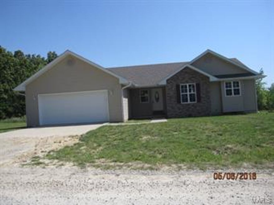 3 Bedroom 2 bath home with a garage with room for 3 cars or boat. The deck overlooks a little pond behind the home.  Property has a high efficiency  heat/air system to keep the bills low.  Home has 2x6 exterior walls.  Call for your personal showing.