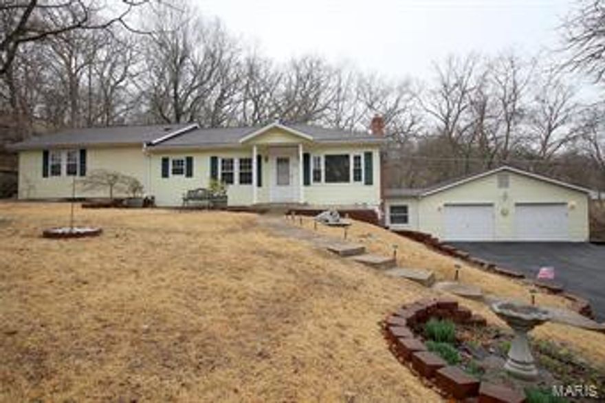 Sitting on almost 1 acre, this Ranch-style home offers 3 Bedrooms, 2 Full Baths and an OVER-SIZED 2 Car Garage. The Living Room and Dining Room offer laminate flooring. You will love the spacious, vaulted Master Bedroom that boasts 2 walk-in closets, recessed lighting, French doors out to the back deck where you can relax and enjoy the privacy, and a luxury Full Bathroom with jetted tub, shower, double sink vanity and skylight. Enjoy the additional living space in the lower level Family Room. Additional features include: newer architectural shingle roof approx. 2-3 years old, thermal windows, newer kitchen, 6 panel doors, 200 AMP electrical panel with 100 AMP panel for the garage, security system Plus More! HSA home warranty is on this property for the buyer's peace of mind. What a Great Place to Call Home!
