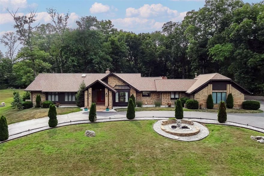 Experience the resort-like ambiance of this remarkable home on a private acre lot located within the exclusive Meadowbrook CC Estates. Renovated with exceptional craftsmanship, the open floor plan seamlessly combines functionality with an inviting atmosphere, ideal for both everyday living & entertaining. Many designer elements including stunning flooring, kitchen upgrades & stylishly appointed bathrooms. The master suite is a true sanctuary, reminiscent of a luxurious spa retreat. Access the LL, via the elevator or stairs & entertain in style in the finished media area accompanied by ample additional sitting/storage areas. Also find a well-equipped kitchen, 2 bedrooms & 1.5 baths. Step outside onto the expansive 1500 SF porcelain patio, which connects an impressive 1700 SF indoor area surrounding the pool, complete with retractable roof, ensuring year-round enjoyment, adorned with a waterfall & hot tub. Prepare to be captivated by its charm & elegance. No detail has been overlooked.