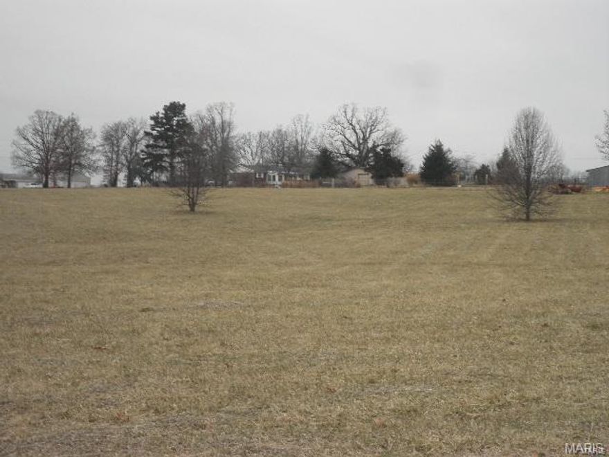 L824  This lot is a great place to build your home. It is outside city limits but has easy access to town and I-44. All roads are paved in this subdivision and the entrance adjoins a county highway. This lot is level to gently rolling . It backs to common ground on Highway WW. Most of it is cleared with a few small trees on the lot. Buyers will have to install a septic system and well.