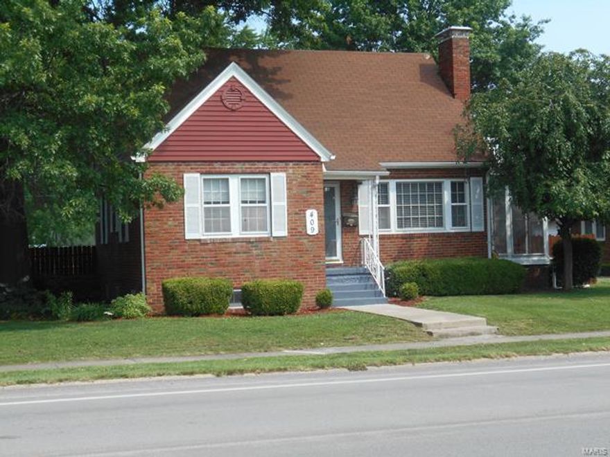 Welcome home! Move-in ready, beautiful 3 bed brick bungalow located on 3 lots w/ 2 detached garages. Nice hardwood floors through most of the upstairs & downstairs. The main floor has 2 bedrooms with carpet over hardwood & shared full bath. The kitchen, dining, & family room all have beautiful hardwoods. Dining room w/ built-in china cabinet & family room w/ ventless gas fireplace & screened-in porch.  Spacious master suite on 2nd floor.  Bath features a shower & separate jetted garden tub. Plenty of closets & storage. Access to walkout balcony from bedroom.  Full unfinished basement has the washer/dryer hookups, HE furnace, & water heater. Plenty of storage & exterior entrance. Basement is not dry.  One garage is 24 x 42 with two doors & additional work/storage area w/ HVAC & half bath. The 2nd garage is 12 x 22, has a drive in door & has an attached covered patio area that overlooks beautiful landscaping in the back yard.