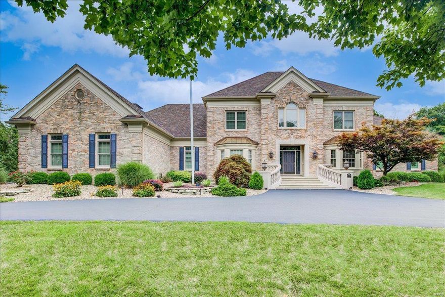 Stunning 1.5-sty on lush 1.8-ac setting. Gorgeous 2-sty marble foyer opens to study w/built-in bookcases & box beam wood ceiling, dining room w/coffered ceiling & stunning 2-sty great room w/fireplace, wet bar & 2 sets of French doors opening to terrace. Gourmet kitchen boasts 42" white cabinetry, granite countertops, premium grade appliances & very large island w/breakfast bar, 2nd sink & wine fridge. Breakfast room has built-in cabinetry & atrium doors that open to beautiful large, screened porch. Adjoining hearth room w/fireplace. Spacious master bedroom suite w/2-way fireplace, marble bath, very large his & hers walk-in closets and cedar closet. The 2nd floor boasts 3 bdrms w/ensuite bathrooms. LL features family room w/5th fireplace, rec room w/wet bar, media rm, 2nd full kitchen, workout room, sauna & full bath w/laundry closet. Outside is paradise w/beautiful inground pool & gorgeous landscaped grounds backing to dense trees & foliage. ALL TV'S, POOL TABLE/ACCESSORIES TO REMAIN.