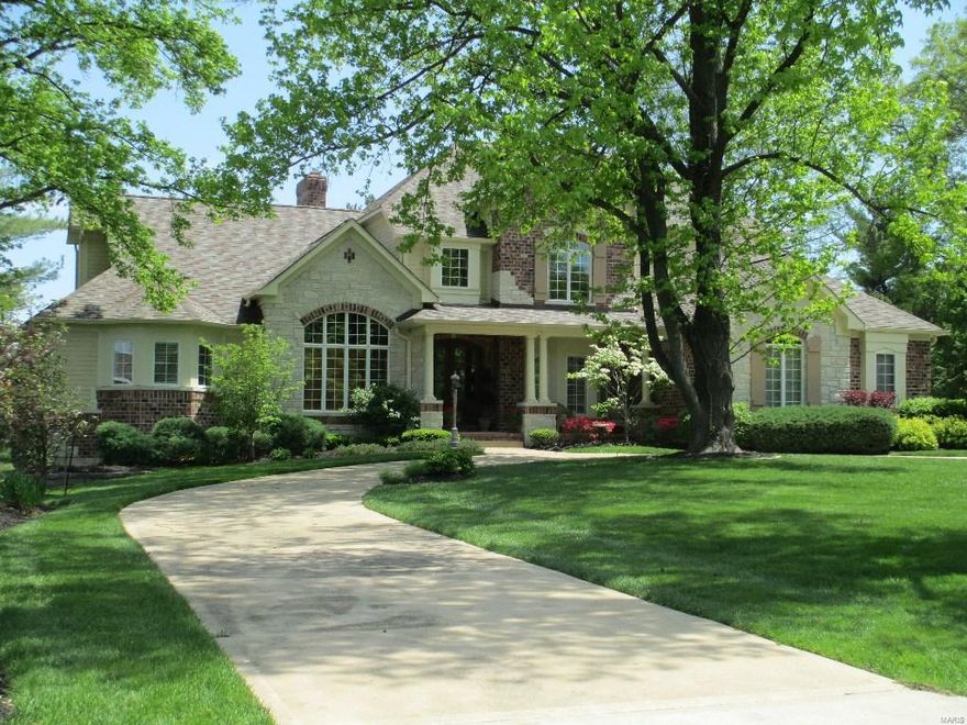 Motivated sellers! Located in the heart of Town & Country, this custom home is set on a park like, over an acre lot. Walk through the stately front doors to a 2 story foyer which sets the tone of what's in store. Study has vaulting ceiling, wood paneling and built in bookshelves. Formal Dining Room with bay window. Living Room with fireplace and wall of windows viewing the enormous backyard. Gourmet Kitchen has upscale appliances, granite counters, butler's pantry, wine cooler and walk in pantry. Hearth Room has vaulted ceiling, floor to ceiling stone fireplace and door to the outside deck. Laundry/Mud Room with custom cabinets. Main Floor Master Bedroom Suite has sitting room, fireplace, luxury bath and a unbelievable walk in closet. Upstairs has 3 Bedrooms all en suite, computer area, bonus/media room and laundry hook up. 2000 plus sq. ft. Lower Level has rec area with fireplace, media room, exercise room, wet bar/kitchen, bedroom, and 2 full baths. New roof installed 7/15.