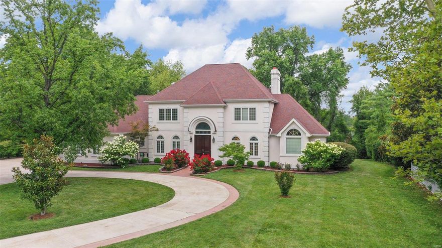 This stunning French Town & Country gated estate on 1.49 acres will take your breath away.  Completely renovated you can move right in!  The main floor offers a marble entry with curved staircase, wood paneled office, a dining room and a gorgeous two story great room.  The new maintenance free deck has access points from each room.  The eat in kitchen has custom cabinetry, granite counters and stainless appliances that opens to the family room.  There is also a large laundry room, walk in pantry and two half baths.  The main floor master offers his and her closets & a luxury master bath with separate tub and shower, dual vanities, and spectacular tile work. Upstairs you will find three additional bedrooms and two full bathrooms.  As if that weren't enough, there is a large finished lower level with a wall of windows leading out to the private, wooded backyard; amazing for entertaining!  There is an additional bedroom, full bath, & an exercise room.  Check out the update list attached!