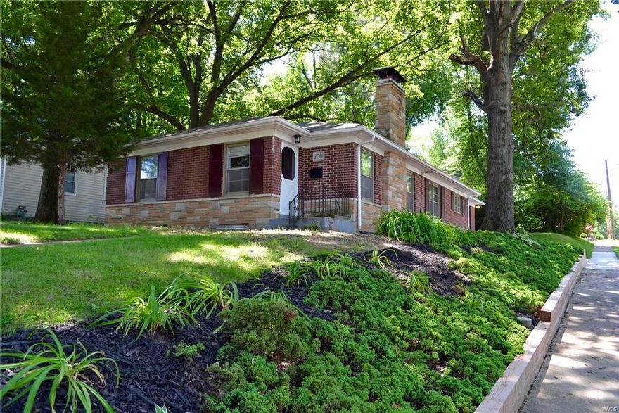Beautiful & Affordable home in Webster Groves, only a block away from fabulous Blackburn Park! This very attractive brick & stone ranch home has been nicely updated and has tons of space to grow into! The updated kitchen features ceramic tile floor, newer cabinets, granite counter tops & stainless steel appliances. Other updates include fresh paint, updated bathrooms, new landscaping, new concrete driveway, gorgeous hardwood floors, and a finished walk-out lower level with tons of valuable living space! The generously sized living room w/ wood burning fireplace has a great open floor-plan into the dining room, kitchen, and breakfast room. Both main floor bedrooms are well-sized and feature double closets. The walk-out lower level is already finished with a full bath, a huge family room with a granite wet bar, 2 additional rooms with windows (possible bedrooms), and unfinished laundry/storage area. Seller is offering a $1,500 flooring allowance to buyer for new basement flooring.