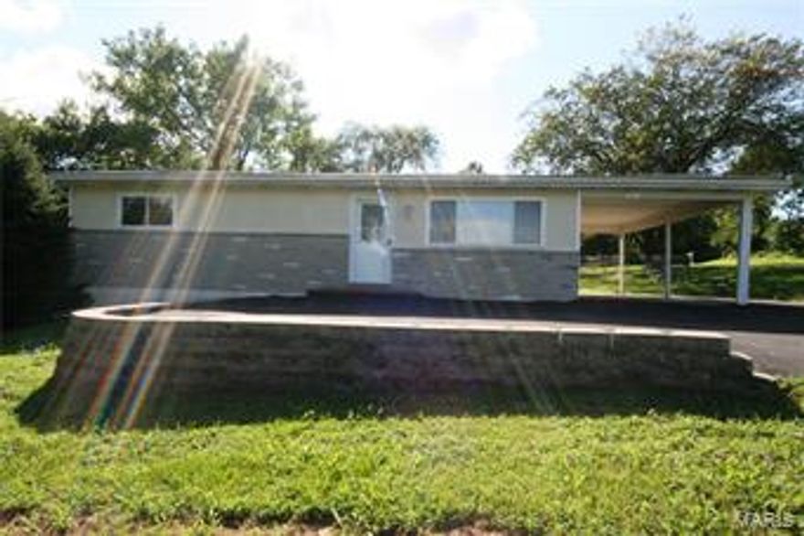 Cute ranch home with 3 bedrooms, 1 updated bathroom, level fenced yard, nice outbuilding, carport, and full walk-out basement w/finished room. Newer roof, AC, windows, & furnace.