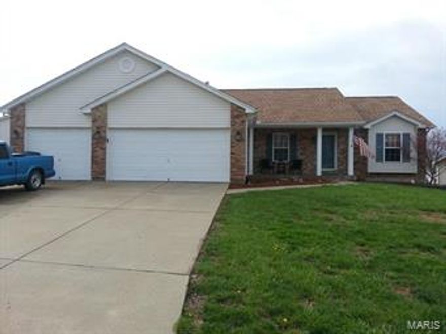 Largest floor plan in subdivision.  Many great features: Open floor plan*wood floor entry*great room with vaulted ceiling*wood burning fireplace*split  bedroom floor plan*his and hers closets*large master  bath with jet tub, double sinks and separate shower* 9×6 main floor laundry*ceiling fans*eat-in kitchen with 42 in. cabinets*large deck off  kitchen overlooks vinyl fenced yard*walk out basement*patio*3 car garage and great curb appeal.