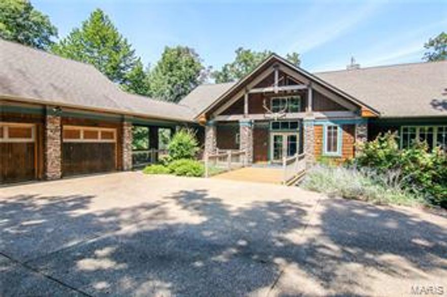 WOW! LAKE ALPINE! This custom home is an innovative design that takes advantage of the natural light and beautiful lake vistas. Custom home features 4 bedrooms, 3.5 baths, multi tiered decks with panoramic views of lake Alpine, all allowing for an abundance of outdoor entertaining venues. As you enter the home, you are greeted with a grand entry hall featuring cedar lined, wood beamed  ceilings, stone accent columns and hand finished Australian Cypress floors. This open design takes advantage of the unobstructed views of lake Alpine and provides the perfect home for entertaining family and friends. The Spacious open kitchen provides plenty of counter space and storage and a breakfast area, perfect spot for your morning coffee. The finished lower level walk out provides plenty of recreational amenities with a spacious rec room with wet bar, leading to a patio overlooking the lake and the private lakeside dock and landing. Some furniture and water toys available