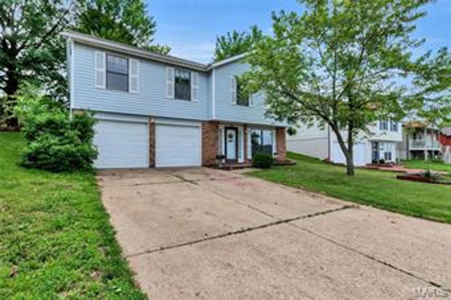 $5000 available in down payment assistance on this gem! So, why rent when you could own??  This gem offers a very open floor and plenty of room for the family.  Huge living room! Spacious kitchen with new canned lighting, brand new flooring, and a double oven.  Large dining area with new lighting and a great view of the back yard out the french doors.  Master bedroom is quite spacious, features his & her closets along with private access to the full bath.  Current owners have stripped wallpaper and painted several rooms of the house.  New canned lighting has just been added to the hallway too.  Woodburning fireplace in the lower level family room.  Back yard features an awesome patio area and large shed. The back yard even offers a view of the arch! The garage is SUPERSIZED and can easily hold 3 vehicles.  Welcome home!!