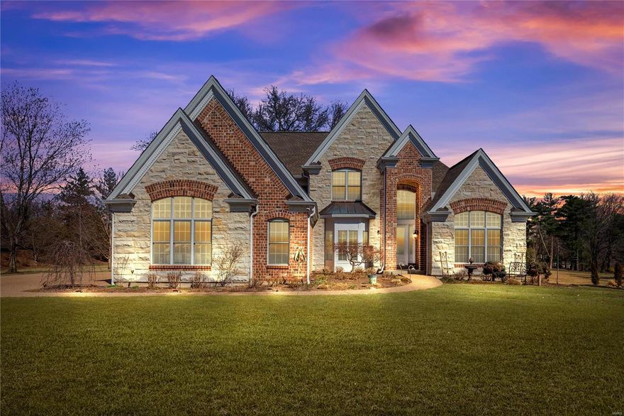 This fabulous 5bd/ 5ba Chesterfield dream home is gorgeous inside and out and is sure to sell fast. Nestled on an expansive 1.75 acre lot this home boasts plenty of curb appeal with low maintenance stone/brick veneer, also includes a large parking area, car garage, spacious back yard and concrete pad for your next gathering. A soaring foyer w/chandelier welcomes you home. The main floor features formal dining rm, laundry rm, hearth rm, office and impressive great room w/fireplace, build-ins, soaring windows and cherry hardwood floors (throughout). A large eat-in kitchen will impress any cook and includes tile floor, tons of custom cabs, large island, double oven, s.s. apps, and breakfast nook. The elegant primary includes coffered ceiling, dual walk-in closets and ensuite w/dual vanity, stand-up shower and jetted oval tub. Upstairs are 3 large bedrooms and two baths. Entertainment will be a breeze in the finished lower level that includes a full bar and quiet cork flooring.