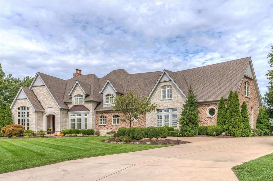 Exquisite 1.5-sty Estate home inspired by classic European architecture! Over 9800 sf of living space enhanced by soaring ceilings, elaborate millwork & wide plank flooring throughout the main living area. Dramatic marble foyer leads to handsome study with leaded glass doors, custom built-ins & wet bar, elegant dining room and spectacular great room with marble fireplace, wide bow window & gathering bar. Chef’s kitchen with glazed cabinetry, Dacor appliances & butler’s pantry adjoins breakfast room with built-in china cabinets & hearth room highlighted by floor-to-ceiling stone fireplace. Coffered master bedroom suite features beautifully appointed bath with Jacuzzi & sitting room. Flared hardwood staircase accesses 3 additional ensuite bedrooms, bonus room & laundry. Lower Level includes recreation room with see-through fireplace & cherry wet bar, media room, game room & billiard room. Impeccably landscaped grounds with covered patio, outdoor kitchen, bocce court, pool & 4-car garage.