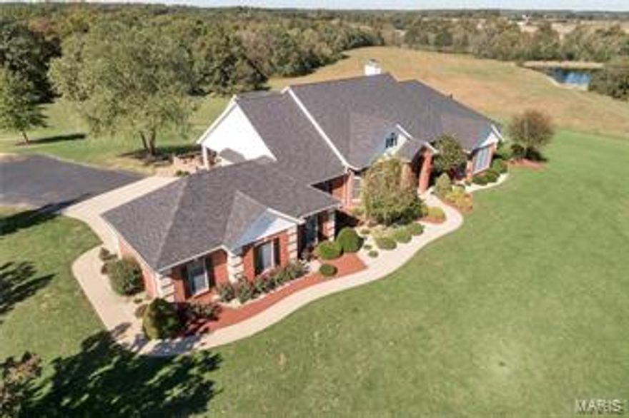 What an opportunity to own a little piece of paradise!Stately Custom Built Atrium Ranch on over 13 acres with a Beautiful in-ground pool. A perfect setting for entertaining, w/ unique custom finishes throughout this 7,000 sq ft sprawling ranch home such as; soaring 11ft. ceilings on the main level along with 9ft ceilings on the LL, wall to wall windows, three fireplaces (2 can be wood burning if desired), hearth room off the chef’s kitchen, luxurious master suite, bedrooms w/ spacious closets & adjoining full baths.  You’ll really enjoy the salt water pool w/ custom outdoor covered kitchen & free standing bath house. Large laundry/mud room was recently upgraded as well. Property is located just outside Troy city limits w/ black top frontage and available county water. NEW ADDITION.. 30X70 SHOP BUILDING WITH CONCRETE FLOORS. Additional acreage available, Over 1 acre lake site here as well. OR ALL 47 ACRES CAN BE AVAILABLE AT AN ADDITIONAL COST! WAIT TILL YOU SEE THIS BEAUTIFUL SETTING!