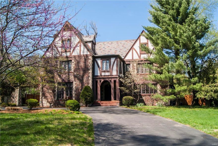 Beautiful home in the sought-after La Hacienda neighborhood. This 2.5 story, 5737 sq.ft. home has a grand foyer, staircase w/ ornate wrought iron railing; huge step-down living room w/ beamed wood ceilings & large inlaid brick & stone fireplace; the family room/library has a one-of-a-kind mosaic tile floor & built in bookcases. Floor to ceiling windows & beautiful custom millwork & molding throughout. The kitchen has a center island w/ prep sink & Jennaire gas cooktop, a Subzero side by side fridge/freezer & electric double oven.The second floor has 5 beds & 3 full baths. The larger 2 West Wing bedrooms can be combined into an enormous master suite. One of the other second floor bedrooms has its own bath. The third floor has a living space w/ wood floors, two more full sized bedrooms & a full bath. Above the 2 car attached garageis the carriage house quarters w/ the 8th bedroom w/ bath. rec room in  basement. Outside is a 36' X 15' in-ground concrete swimming pool, & fully fenced yard