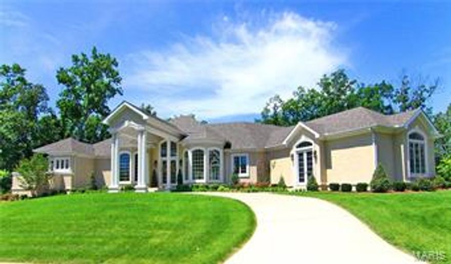 From the moment you drive up the circle drive & pull under the "Porte Cochere" and enter the foyer you can feel the difference with this home. High ceilings & windows along every wall capture you right away. The kitchen & living area are the true heart of this home. Custom cabinetry & viking appliances with prep island & wrap around breakfast bar. Wall of windows and doors draw you to the outdoor pool space & Lanai that makes you feels like your own resort.  Pool area is an entertainers dream w/ tree lined privacy, travertine tile floors with a bar & grill area. Master suite wing with his & her closets & vanities, fireplace, steam shower & french doors that open to the pool. Basement w/ theater area, family room, game room, space for a work-out room & wine room.This stunner is over 7,400 sq ft & perfectly tucked into 1.5 acres with woods creating a secluded & private feel right in the heart of town. Every detail is thought out and there is more! Additional amenity list is available.