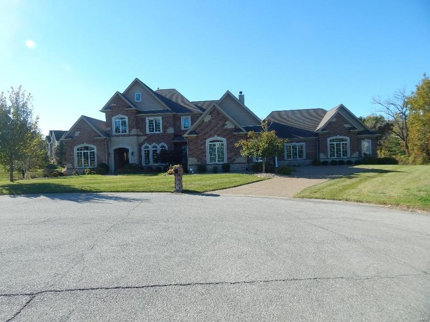 Listing agent must be present for showings to your preapproved buyer
This magnificent custom-built 1.5 Sty features over 7400 sf of living space enhanced by exceptional craftsmanship & contemporary amenities throughout! 2-Sty marble foyer welcomes you home. A delicious gourmet open kitchen with gorgeous granite, custom cabinetry, Center Island, and fireplace is great for entertaining. Main Floor Master suite has fireplace, walk in closets and a Luxury master bath with dual vanities, Jacuzzi tub and large custom shower. Upstairs has 3 bedrooms with there own private bathrooms, walk in closets and custom built ins. Lower level offers a master suite along with game room, workout room, wet bar, and basketball court. This home is located in a private gated community. Must see this home to see all its amenities.