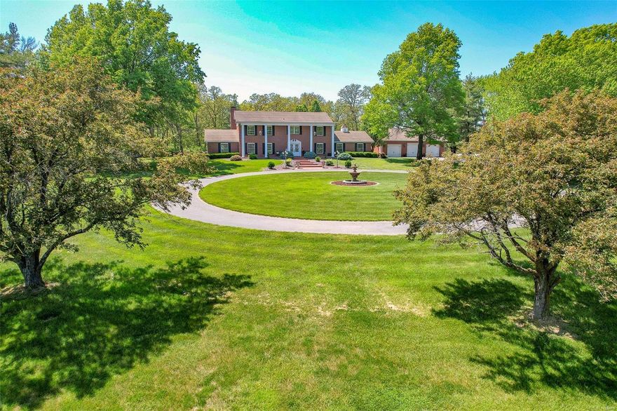 Quality built home located in a beautiful north side neighborhood, this 7000 sq. foot Captivating Colonial was completely renovated in 2009! A private entrance, stocked pond and thoughtfully landscaped grounds invite you into the front door. This stunning property features an oversized inground pool-with automatic cover and new liner, game room, home theater, granite countertops throughout, hand scraped hickory hardwood floors, a heated 60 x 64 multipurpose building (Indoor pickleball?), 4 car garage, screened in porch, and a separate 840 sq ft. apartment. The heart of this home has main level living with a gourmet kitchen, beautiful custom cabinetry, top of the line stainless appliances, walk-in pantry, a great room, a exquisite master suite, 2 dining areas and an office. This property is within close proximity to parks and just minutes from excellent schools. This wonderfully designed property is perfect for entertaining and everyday living!