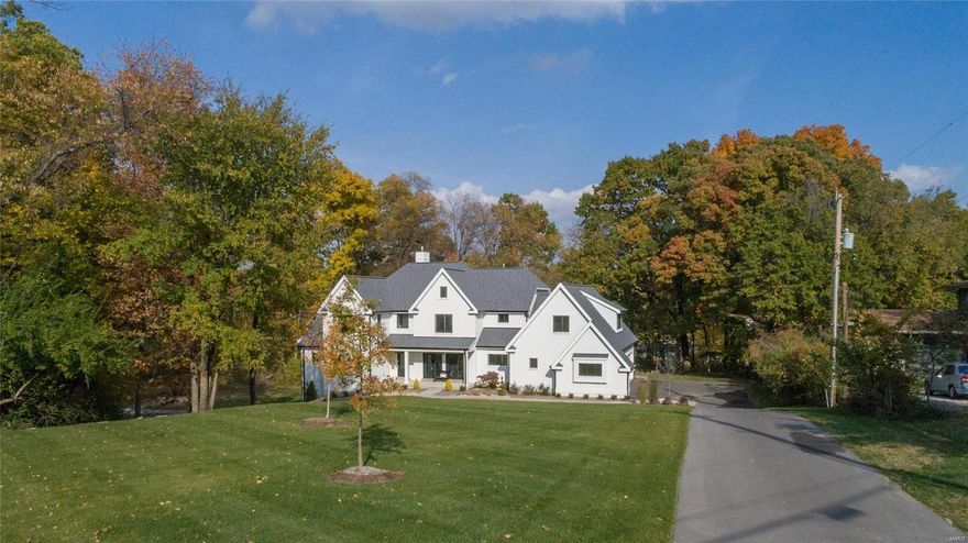 3-year-old home with over 6700sq ft of living space awaits the buyer of this exquisitely designed 1.5 story home. Sophisticated yet casual-perfect for today's lifestyle!
High end finishes & fabulous open floorplan, this 5+ bedroom, 5.5 bath residence offers a light filled living room with bookcases, formal dining room with French doors and stunning main floor master-suite with huge walk-in closet and spa-like bath.
Chef's kitchen w/ center island, quartz countertops & high end appliances that flow into the hearth room with French doors to the outside covered patio w/outdoor fireplace. Main floor laundry/ mudroom.
Upstairs you will find 4 spacious bedrooms with 3 full baths & walk in closets, 2nd laundry room and super playroom/office area.
Walkout lower level with additional bedroom, full bath and entertainment area access's the lower level patio. 
Hardwood floors, 9'ceilings, front and back staircase, inground sprinkler system, 4 car garage and private 4.7 acre lot. Additional Rooms: Mud Room