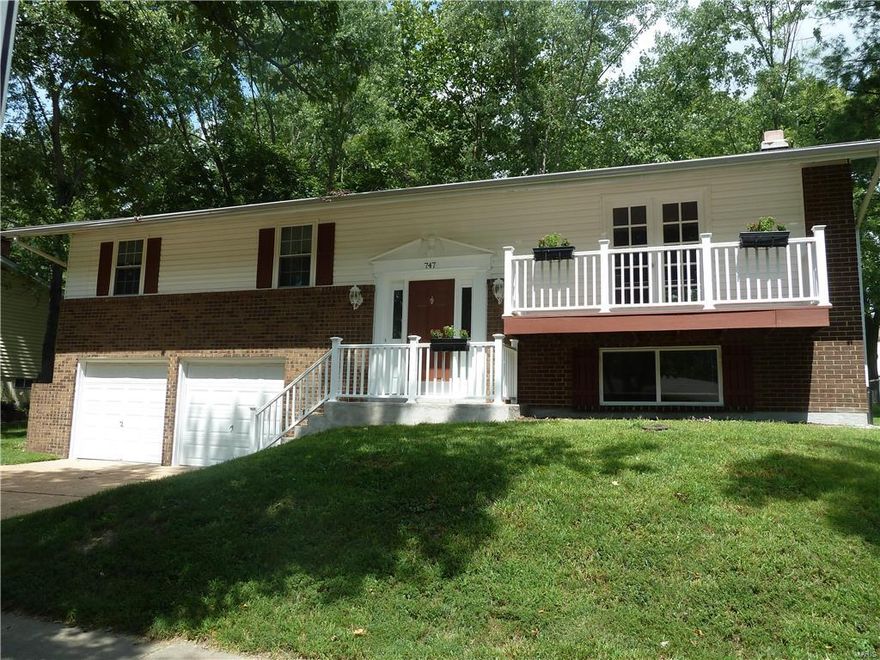 Move in ready!  Enjoy this 3 Bedroom 2.5 bath home with generous living spaces and stylish finishes. Beautiful hardwood floors and plenty of natural light flow throughout the open, airy floor plan.  Updated Kitchen with newer appliances, ceramic tile flooring, backsplash with glass tile, gas stove &  glass cabinets with extra counter space.  Wood floors in the living room with French doors that open to a balcony & in the dining room which walks out to a deck overlooking a large back yard.  Three comfortable bedrooms on the upper level with the master bedroom having its own full bath with an oversized shower and built in seat.  New insulated window & vinyl blinds throughout.  The  Lower Level family room has a wood burning fireplace and half bath.  Extra deep 2 car garage. Great location and close to Manchester Park and the Parkway Schools. 
 No need to search further!