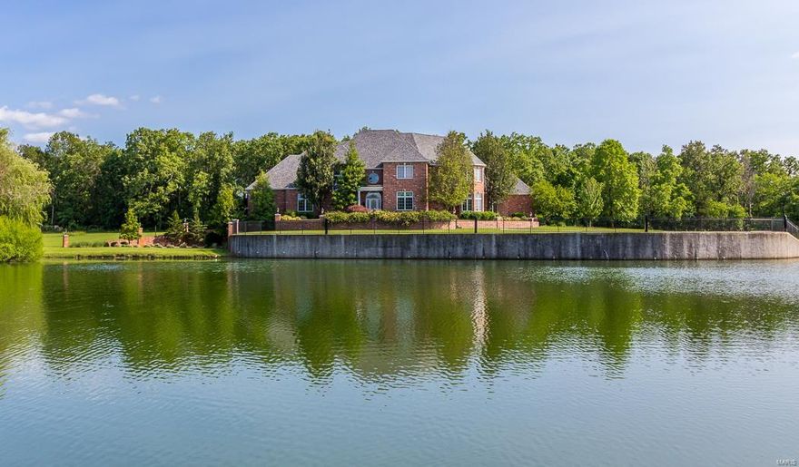 YOU WILL BE IMPRESSED UPON ARRIVAL TO THIS STATELY BRICK MANSION WITH A PRIVATE LAKE ! THIS HOME IS PERFECT FOR THE FAMILY THAT ENTERTAINS. TWO STORY ENTRY FOYER & LIVING ROOM WITH EXPANSIVE FLOOR TO CEILING WINDOWS,  CROWN MOLDINGS, THIS  FULL BRICK TWO STORY HOME WITH A FULL BASEMENT OFFERS 6 BEDROOMS, 5 FULL, 2 ONE-HALF BATHS, 3 FIREPLACES, FORMAL LIVING, DINING, KITCHEN, MANY HARDWOOD FLOORS, A HEARTH ROOM W/ACCESS TO THE SCREENED PORCH. MAIN LEVEL MASTER SUITE W/JETTED TUB, SHOWER, 2 WIC CLOSETS, THE SECOND LEVEL HAS 3 BEDROOMS EACH WITH A PRIVATE BATH, ONE SERVES AS THE  2ND MASTER SUITE WITH  A LARGE SETTING ROOM, LOWER LEVEL HAS THE 2ND FULL KITCHEN, GAME-RECREATION ROOM,  FAMILY ROOM, 2 ADDITIONAL BEDROOMS, WITH A JACK-JILL BATH, 1/2 BATH FOR GUESTS. LOWER LEVEL PATIO. THE 4 CAR GARAGE HAS A FULL  CONCRETE ROOM BELOW PERFECT  STORAGE AND STORM SHELTER. HEATING & COOLING SYSTEMS FOR EACH LEVEL. SECURITY SYSTEM. 
 THIS HOME IS OCCUPIED BY THE ORIGINAL OWNER AND IS IMMACULATE!! Additional Rooms: Sun Room