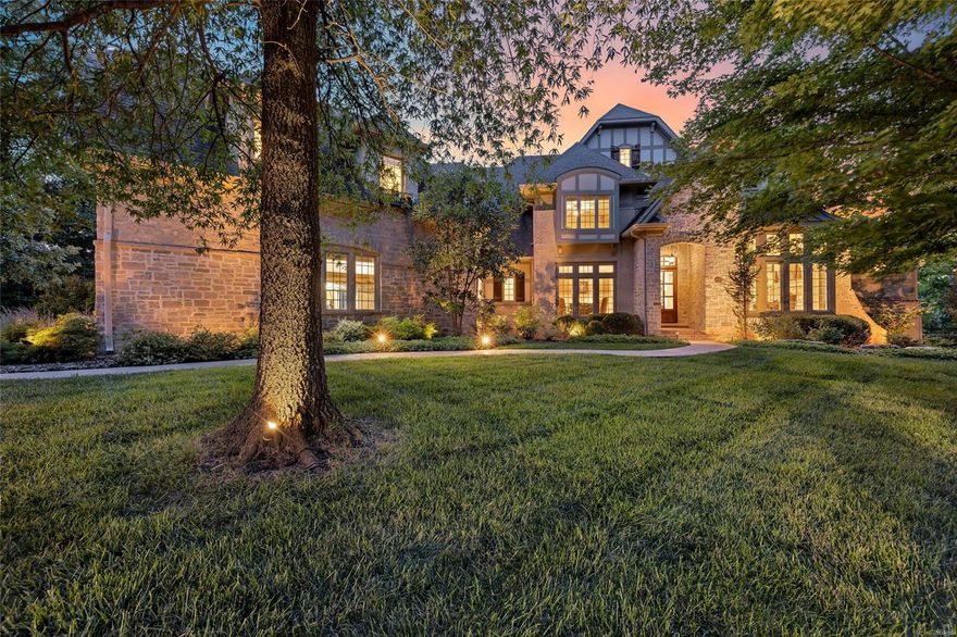 Surround yourself w/ elegance & beauty in this architecturally impressive home in Meridien, one of the most prestigious communities in West STL Co. This is the ultimate setting for social gatherings or your own peaceful enjoyment. A low maintenance deck overlooks a large patio w/ stone fire place & infinity pool that flows into sensational tree lined sunsets. An elegant arched stone entry leads into the foyer adjoining a study w/ box beam ceiling, book shelves, & formal dining rm. A luxurious kitchen featuring distinctive cabinetry, butler’s pantry, & premium appliances is open to a brkfast area & hearth rm w/cathedral ceiling & floor to ceiling stone fireplace. Windows across these rms offer beautiful seasonal views of the tree lined property. Retire to the serenity of your main flr master bdrm suite w/ it’s unique coffered, box beam ceiling. Upper-level bdrms each have a private bath & access to the loft area. The LL rec rm opens onto a stone patio w/ bar, grill, fireplace, & pool. Additional Rooms: Mud Room