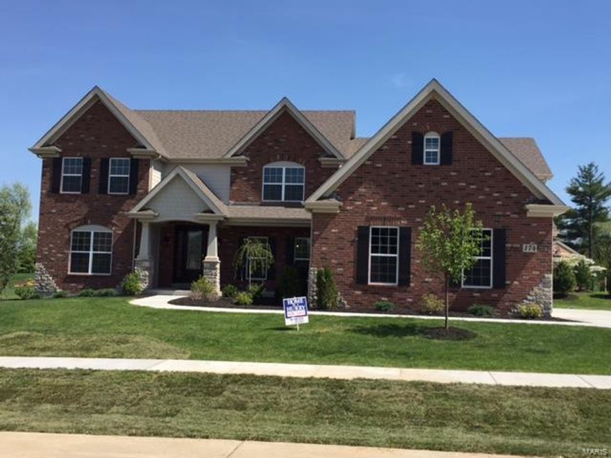 Beautiful and Stately 1.5 story New Home on a 3/4 acre homesite in the highly desired Belle Maison community is READY NOW. This fantastic central location with mature trees and a lake gives you easy access to 270 and Hwy 40. This beautiful home features:  Very open floor plan with a huge Gourmet kitchen w/ custom cabinets, large granite Island, desk,  custom pulls, Hearth Rm with stone front fireplace & vaulted ceiling, 2-story Great Rm, Expansive laundry w/ cabinets, Large concrete patio, 24 x 24 game rm w/ balcony, 3 piece crown molding at foyer, Great Rm and upstairs Hallway. Sculptured ceiling and chair rail w/ wainscoting in dining room, 3 car side-entry garage. Spacious 1st floor Luxury Master Bathroom suite. 4 Bedroom 3.5 bath, jack & Jill bath plus much more!  9Ft Ceilings on the First Floor, Gas Fireplace in Family Room, Riverwood Staircase with Iron Balusters,  30 Year Architectural Shingles.