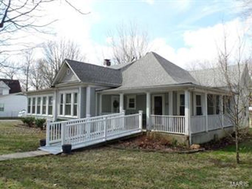 Turn of the century Cottage home on tree lined West Hardy Street. Historic Hardy St. is one of the original streets in St James. This home beckons to the past with original baseboard trim and doors. The home has been lovingly cared for and added on over the years. Extra insulation in walls and ceiling and new windows. Average utility bills last year $269. That includes everything!!! The most recent addition- master bedroom, sitting room and bath. Additionally, there are 2 bedrooms with a raised hall bathroom. The fireplace flu requires some work and needs a damper installed. Home has high ceilings through out. Galley kitchen is in great condition and updated. Home has a newer roof replaced in 2009. New windows. Blown in attic insulation. Vinyl siding in 1998. Deck on the back and a utility room. Detached garage. There's a ramp to the front door that has been beautifully incorporated into the front porch. Wrap around covered front porch is a great place to relax. Being sold "as is".