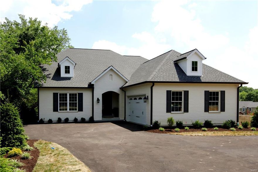 This new construction is a dream with every amenity. Exceptional floor plan with a two story entry, bright living room, well appointed dining room with coffered ceiling, a fabulous kitchen with beautiful stone counter tops, Jenn Aire appliances, center island, glass front cabinets and a lovely breakfast room which opens to the expansive great room and beautiful deck. The master has a sitting area and master bath with double bowl vanity, separate tub and large shower, magnificent stonework and generously sized his and hers custom closets. The upstairs has two gracious bedrooms each with their own en suite bath. The unfinished walk out lower level has rough in for a bath. Other amenities include a completely outfitted  first floor laundry, wide plank hardwood floors, oversized garage, elegant door hardware, exceptional millwork, beautiful landscaping and irrigation system. You'll fall in love with this house the minute you step thru the front door! Additional Rooms: Mud Room