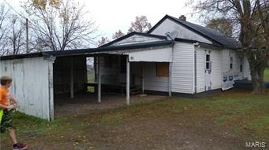 Fixer-upper Farmhouse. Original structure, rough cut oak/cypress with metal roof, new windows, bathroom almost complete. Started plumbing work under house. New pumphouse and electrical service. Up to date breaker box and wiring ran for A/C, hotwater, etc. House needs lots of TLC, siding, septic, etc. Lots of potential. Home sits on 3.5 acres +/-. Beautiful view of valley and neighboring farms. County Road 253 is also in process of being paved with work already in process. Property is being offered as an old Farmhouse/Fixer-Upper with no guarantees. Property to be surveyed out to get correct legal description. Additional Rooms: Mud Room