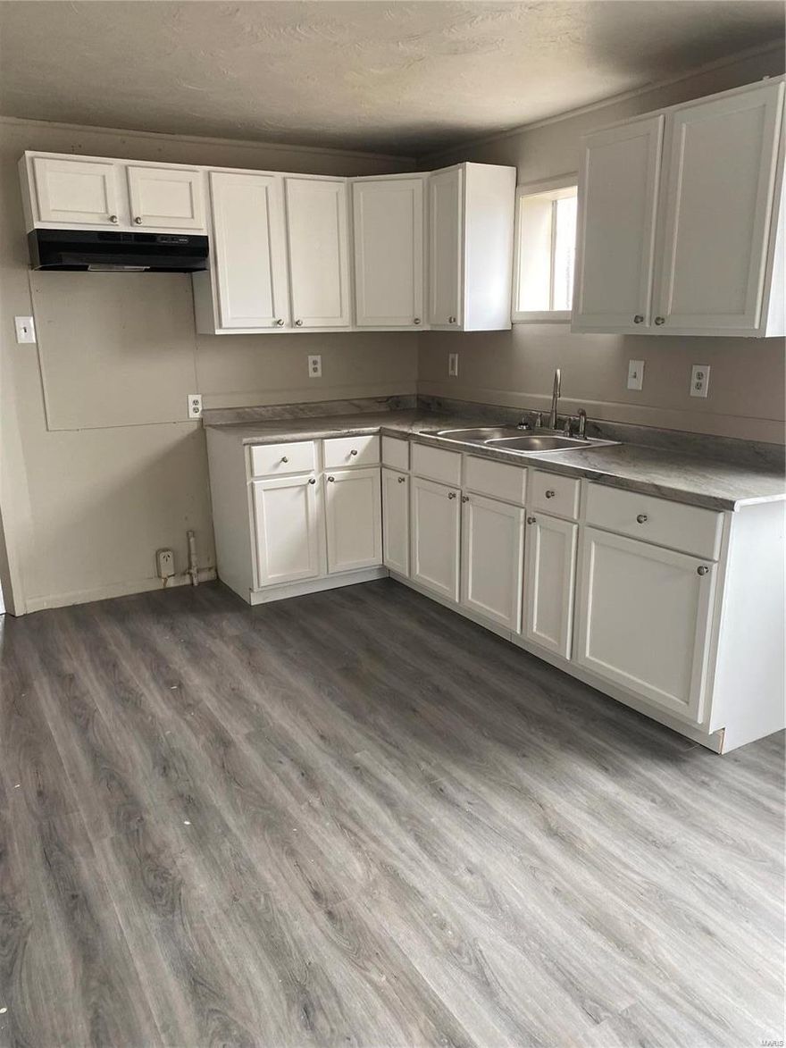 Overland opportunity awaits!  Renovated 2 bed 1 bath with basement.  New vinyl windows, new paint, all new vinyl plank flooring throughout.  New kitchen cabinets, countertop, faucet, exhaust fan.  New vanity in bathroom.  New roof replaced about a month ago with Architectural shingles. Newer water heater.
Some repairs needed on exterior but great starter home or investment property.  Tuckpointing recently done at chimney and right side of house.  Please write offer on Special Sales Contract.