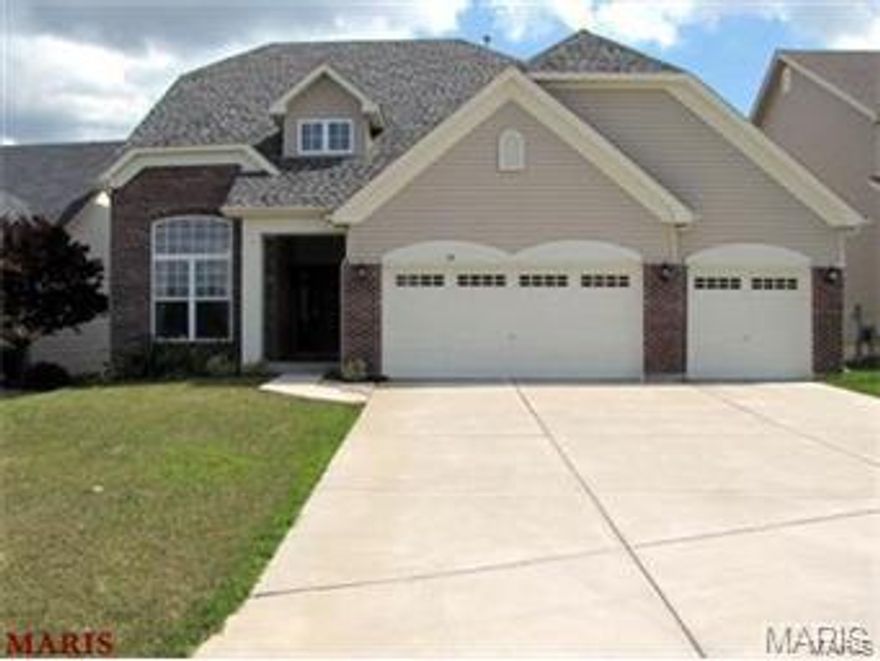 New lower price. Immaculate executive home, open floor plan with wood floors in Great room, kitchen and breakfast rooms. Formal living room with palladium window, soaring ceilings, owner used as an office. Formal dining room has columns, family room has fireplace, kitchen has Quartz counter, Stainless Steel appliances, walk in corner pantry, butterfly island with columns. Beautiful stained staircase leads to vaulted Master the en-suite is vaulted with plant shelf, his and her vanities, ceramic tile, glass block window, marble tub and shower. Other two bedrooms are nice sized with a full hall bath plus bonus/family room at end of hall currently used as a TV room. Laundry and half bath is located off 3 car garage on mail level. Come and see it is move in ready.