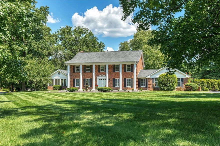 Classic 2-sty Georgian Colonial in prestigious Strathmore. Distinctive design elements & custom amenities including marble & handscraped hardwood flooring, detailed trim work, plantation shutters & integrated sound system are featured throughout the home. Impressive marble foyer leads to formal living & dining rooms and spectacular family room with wide bay window, marble fireplace & atrium door to screened porch. Designer kitchen with granite countertops, 42” cherry cabinetry, premium appliances & 9’ center island adjoins vaulted sunroom with 10’ wet bar & wall of windows that overlook parklike backyard & pond. Spacious master bedroom suite with luxury bath with brick fireplace provides an appealing retreat. 3 Additional bedrooms & hall full bath complete the 2nd floor living quarters. Lower Level entertainment space includes recreation room, office & full bath. Atrium door opens to outdoor living area with stamped concrete patio & resort style pool surrounded by landscaped gardens. Additional Rooms: Sun Room