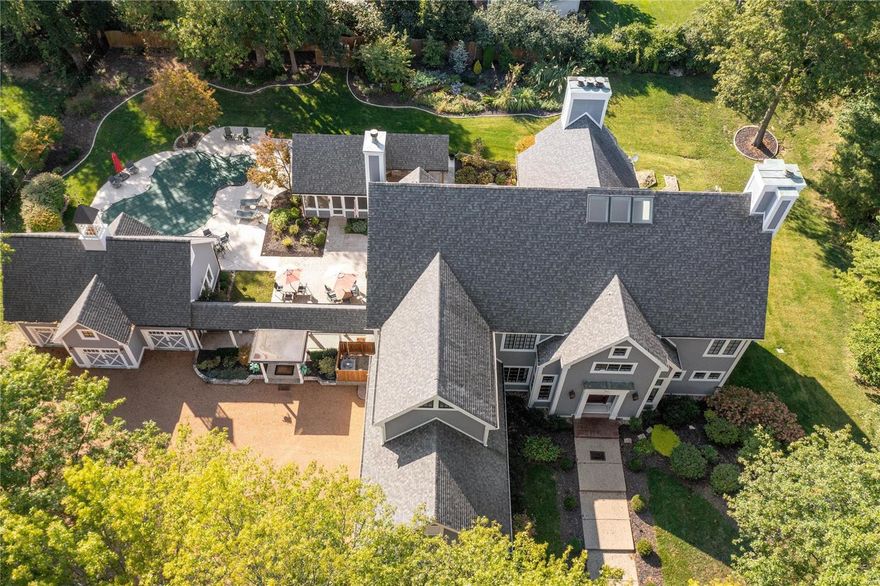 Situated on 2+ private acres in central Ladue, 9719 Conway is the pinnacle of refinement, complete w/ an enviable outdoor entertaining area & pool. Having just completed thorough maintenance & renovations, the property showcases exquisite architectural details & stunning design choices. Soaring ceilings & an open floor plan offer gracious living spaces thru out main floor: Great Rm w/ walls of windows; Formal dining w/ coffered ceiling; Living rm w/ wet bar; 3 main flr fireplaces. Chef's kitchen offers a sophisticated entertaining venue: high end appliances, custom cabinetry, a generous marble island, & flows to cozy hearth room w/ oak-beamed ceiling. Primary suite is a retreat w/ new luxurious bathroom. LL has a 2500 btl temp-controlled wine cellar, new kitchen, 2 gyms, guest suite & rec room. Exterior features include: 5 car garage, expansive patios, newly refinished saltwater pool, gazebo, outdoor kitchen, fire pit, & a landscape design that showcases this truly special property. Additional Rooms: Mud Room, Wine Cellar