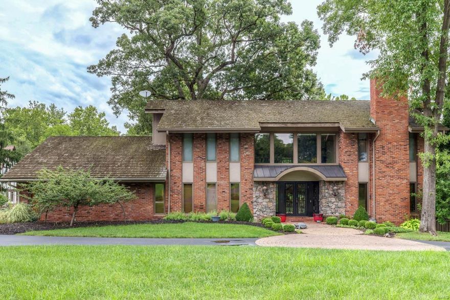 Once you arrive to this rustic contemporary situated on 1.26 acres you are immersed in its unique & warm atmosphere.  The large entry greets you w/ a winding iron rod & wood staircase, large picture windows and views of the dining rm and den. The lodge-like great room has a 20+ft vaulted ceiling, w/rafters, wood burning fireplace w/floor to ceiling brick surround & wet bar.  Enter into the cook’s eat-in kitchen featuring stainless steel appliances, 2 dishwashers, & windows galor. The gracious master bedrm suite has a private deck, beautifully appointed master bath and walk-in closets. The open hallway on the 2nd fl gives you an awesome view of the great room. Four other bedrms each paired with updated Jack and Jill baths complete the 2nd fl.  Finished huge lower level has a wet bar, full bth , exercise rm. & walks out to the salt water pool and patio. Three-car garage, main floor laundry, office, mud rm, & in ground sprinkler system are all a part of this special home. Additional Rooms: Mud Room