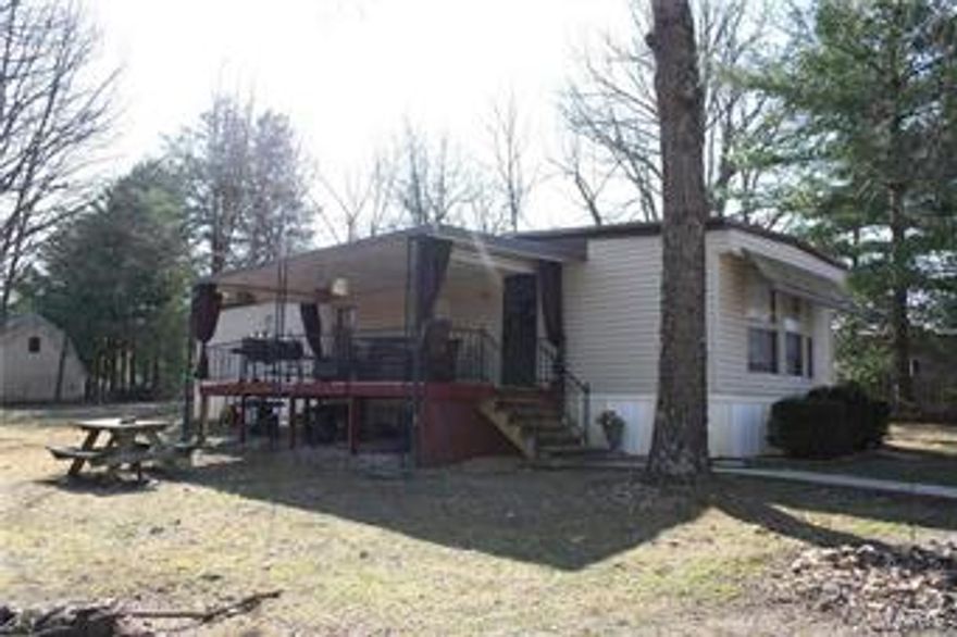 This is a well taken care of property close to Bennett Spring State Park!  Would make a wonderful second home!  Trailer has had some updates including new flooring.  Property has a new in ground storm shelter, two storage buildings and a wonderful park like setting.  This property also has an RV hookup.  The sale of this property includes all furnishing in the trailer and on the deck including the BBQ and new outdoor fireplace.  The two twin beds in the spare bedroom has only been slept on one time and still has the plastic on it.  The King size bed has had covers over the mattress which is only two years old.  Do not miss out on this one!