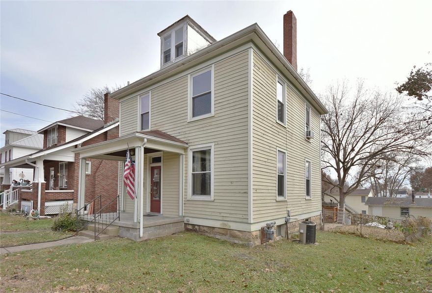 Large 2-story with 9 ft ceilings on the main level offering updated flooring while maintaining the original woodwork on most of the windows. Most of the windows have been upgraded and tilt-in for easy cleaning. A large sitting room/entry foyer gives you options as soon as you walk in the door. A kitchen with an island that is perfect for bar stools gives you the freedom of eating in the kitchen or dining room. The kitchen also has a handy pantry! All of the sleeping areas are on the 2nd floor and the master features a private balcony. The second floor features all of the original hardwood flooring and hardwood around the windows. There's a lot of character in this home that you just don't find in most! A fenced yard keeps the kiddos and pets where you want them and the home includes a one-car detached garage. There is a washer/dryer hook-up and partial bath in the basement. The home has already passed the City of Washington Occupancy Inspection and is ready for its new family!