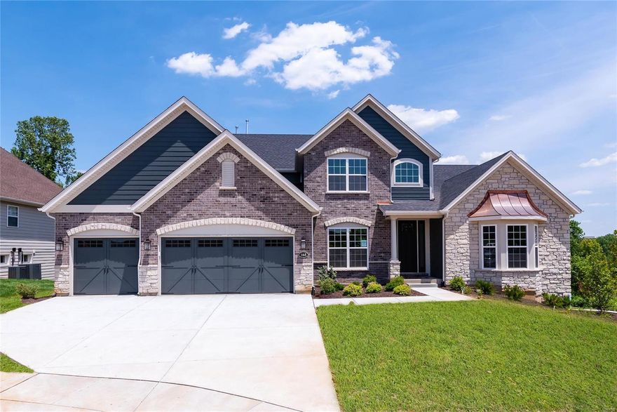 Beautiful 1.5-story home ready now in Chesterfield minutes from Hwy 141 and I-64. The open t floor plan features 4 bedrooms, 3.5 baths, a 3 car garage. cul-de-sac with walkout Includes 9' first floor ceilings, 11' in the great room, hearth room with floor to ceiling stone fireplace, acook’s bath, spacious master bedroom on main floor, formal dining room and study. Deluxe kitchen with granite, large center island, 42' cabinets, crown molding, stainless steel appliances. Hardwood flooring throughout the main living areas. 8' tall doors on the first floor and more! Upper level with bonus room & 3 bedrooms and 2 full baths.