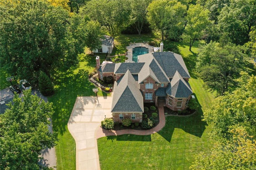 Astounding custom built home situated on a 1.49 park like private setting. Over 6000 sq ft of living space, featuring everything you would want in luxury and more. The millwork and attention to detail work is amazing! Turret in front. This is a great home for entertaining! Continuously maintained and upgraded since built. The list of upgrades and special features is extensive. (See comments under each photo). Grand entry foyer leads to the two-story great room with a wall of windows. The chef's kitchen opens to the vaulted hearth rm and walks out to terrace. The view of the backyard with pool is breathtaking! with redone pebble tech pool deck, and expansive level treed grounds. Main floor master with private deck. Main & 2nd floor laundry. Every bedroom has own private bath. Expansive Lower Level with walkout. Great entertaining space with rec room, custom bar, stage/theatre, sauna, den, cedar closet and workout room. 3 zoned HVAC. 3 Fireplaces, 2 gas/wood burning.